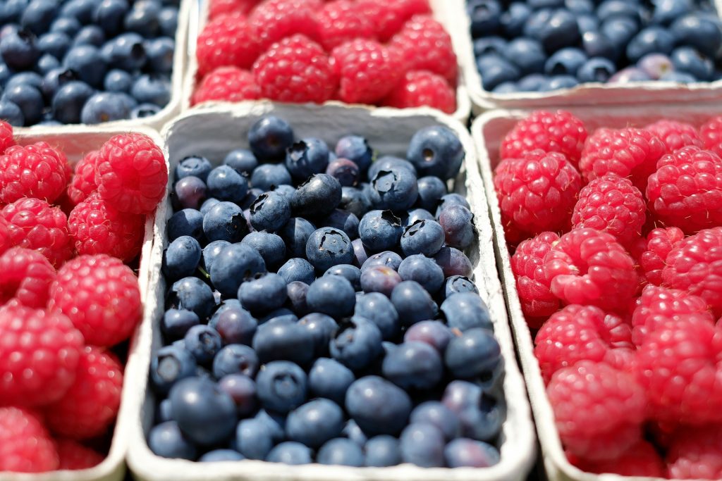 Containers of blueberries and raspberries